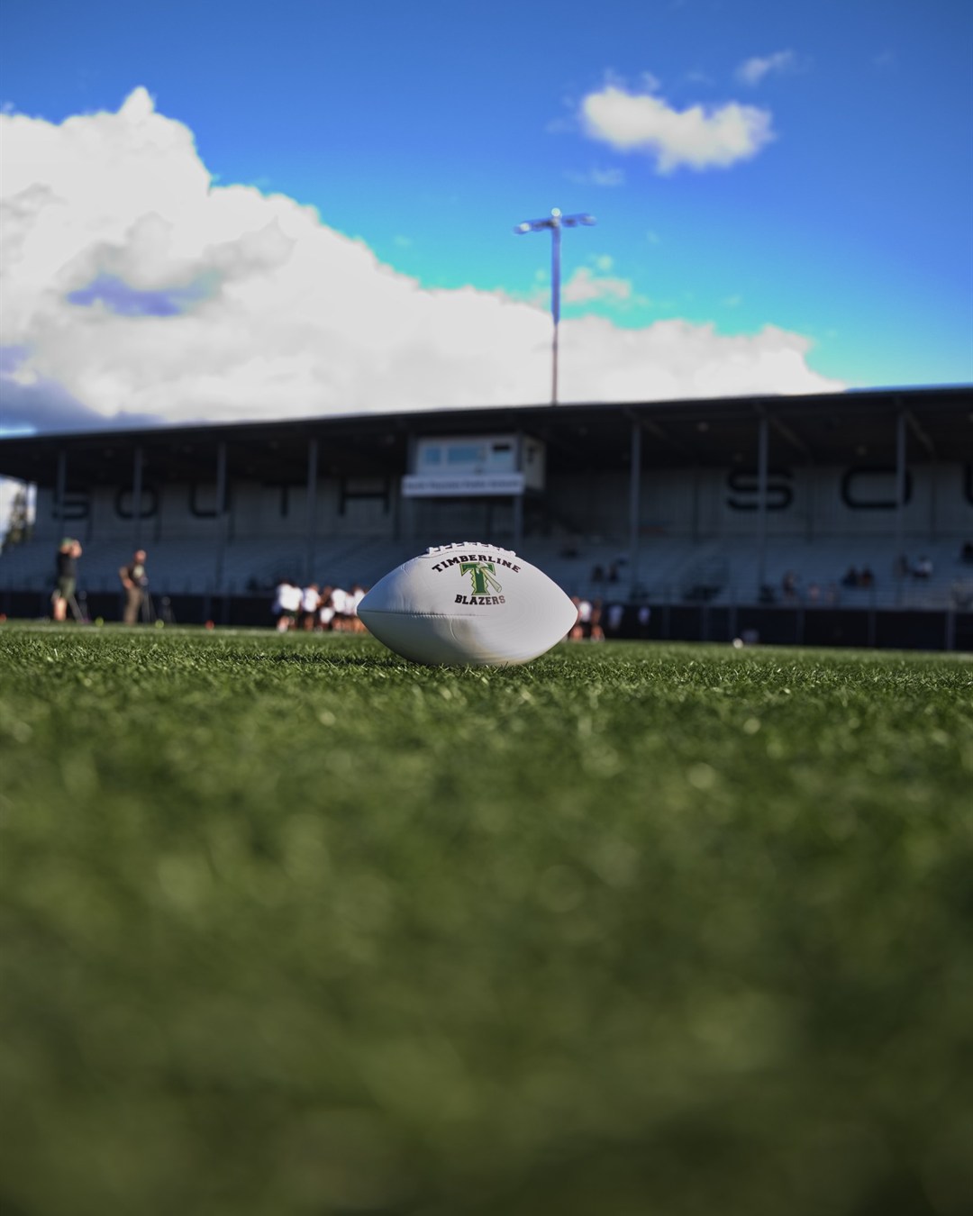 A Timberline Blazers football on the field at the stadium