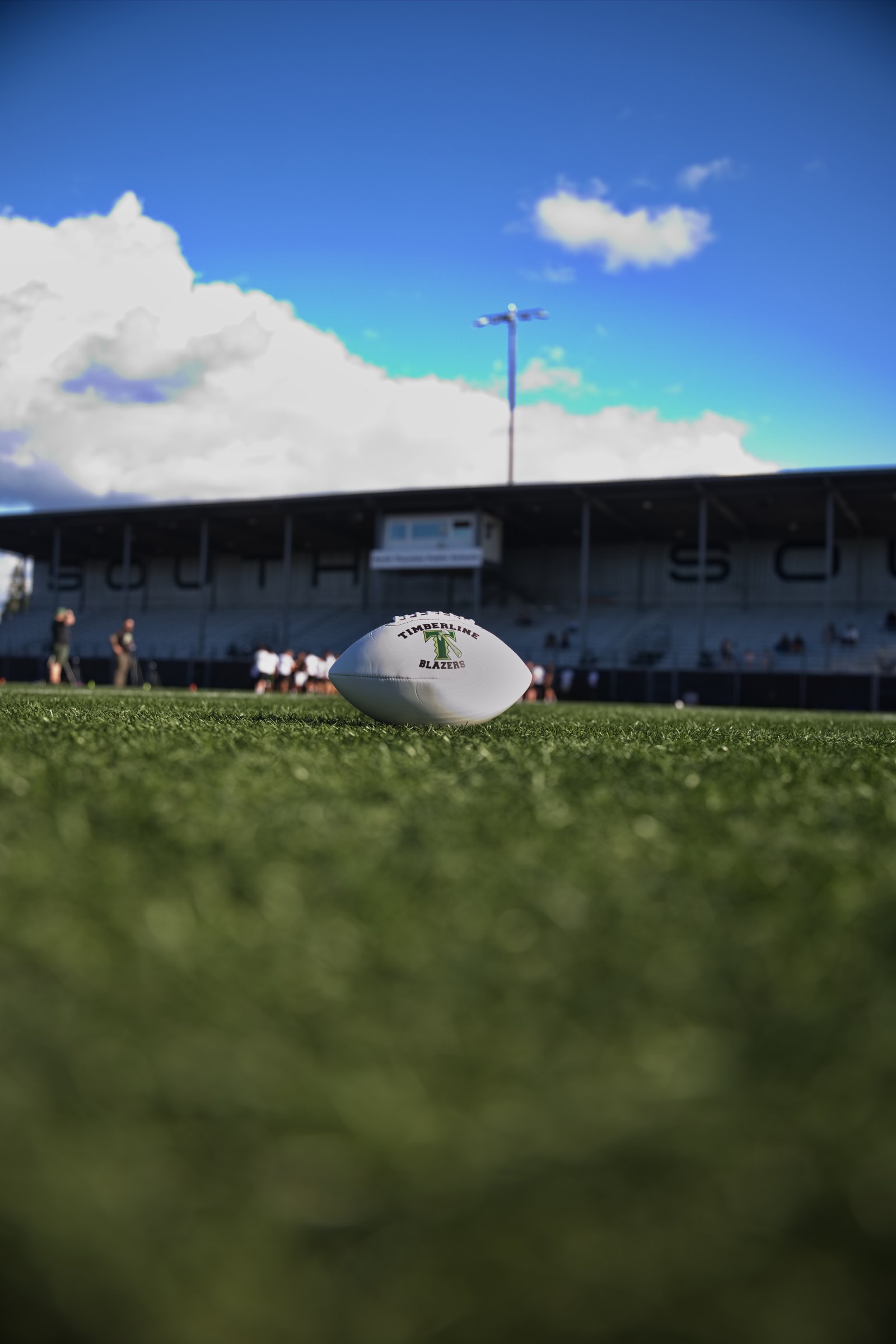 A Timberline Blazers football on the field at the stadium