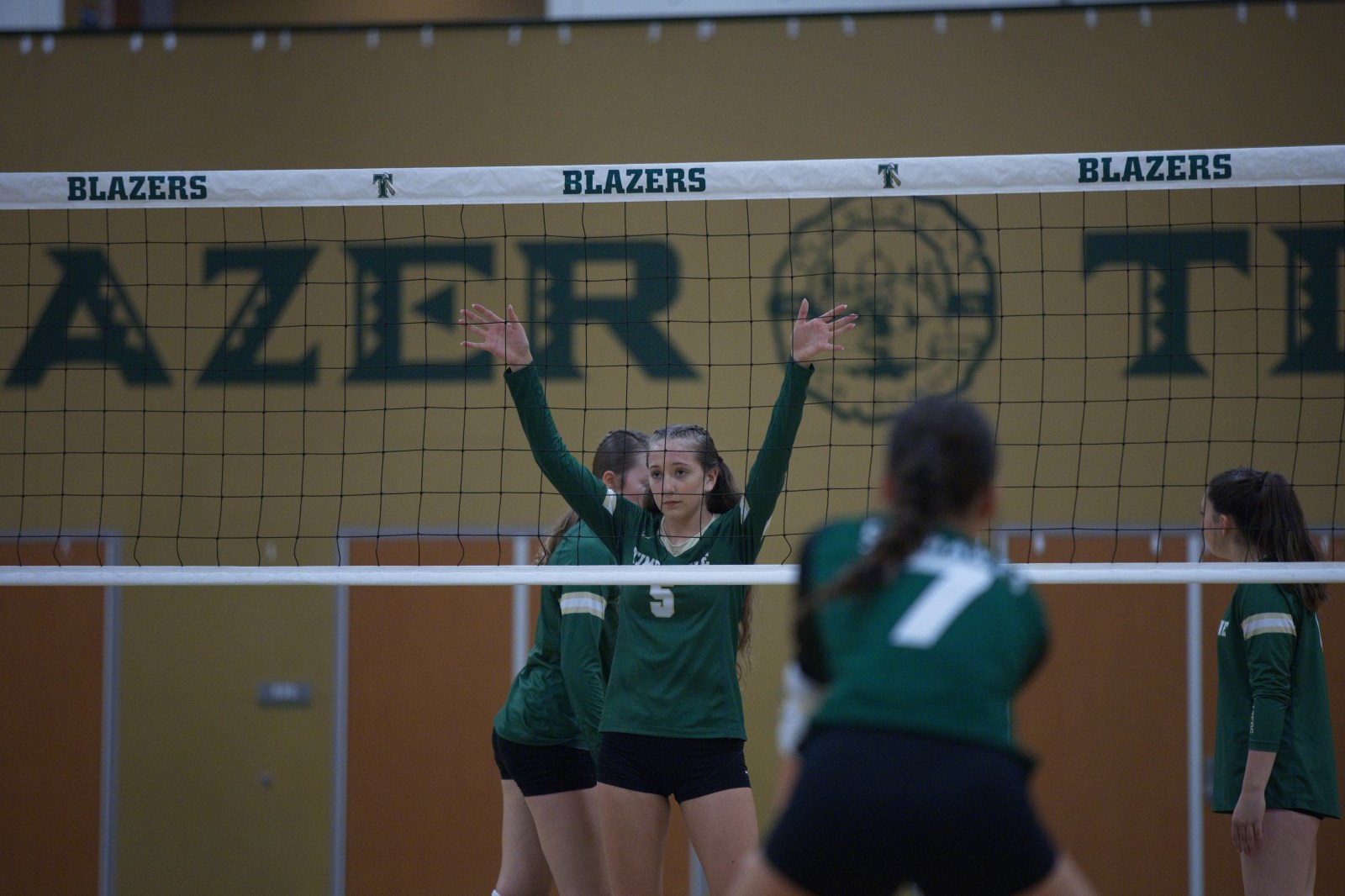 Timberline volleyball player at the net